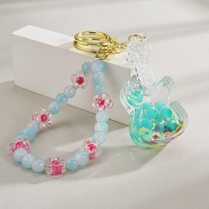 Wholesale Acrylic Oil in Quicksand Bottles, Luminous Violins, Beaded Chains, Keychains